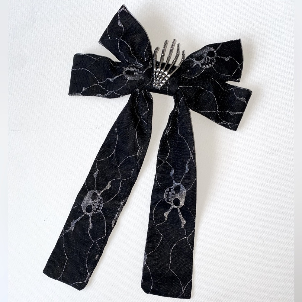 Piper K - Halloween Bow Barrette Skeleton Skull W/ Hands In Middle - One Size